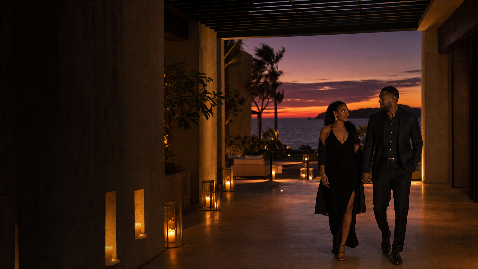A couple arriving at a candlelit oceanfront retreat for Fire and Desire